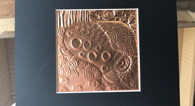 copper embossed zentangle in a black frame